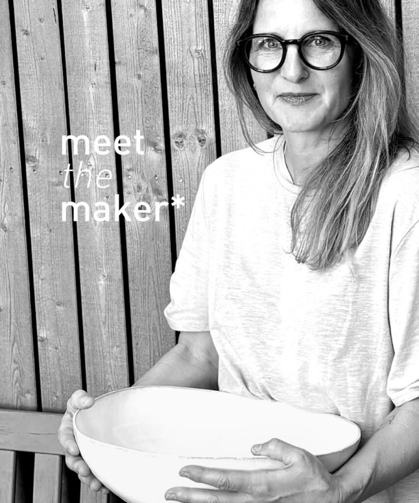 Potrait of Corinne Vontobel holding her ceramic forms.