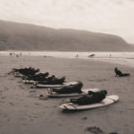 Surf lesson on the beach of Imsouane, Morocco, boards lined up before going into the water.