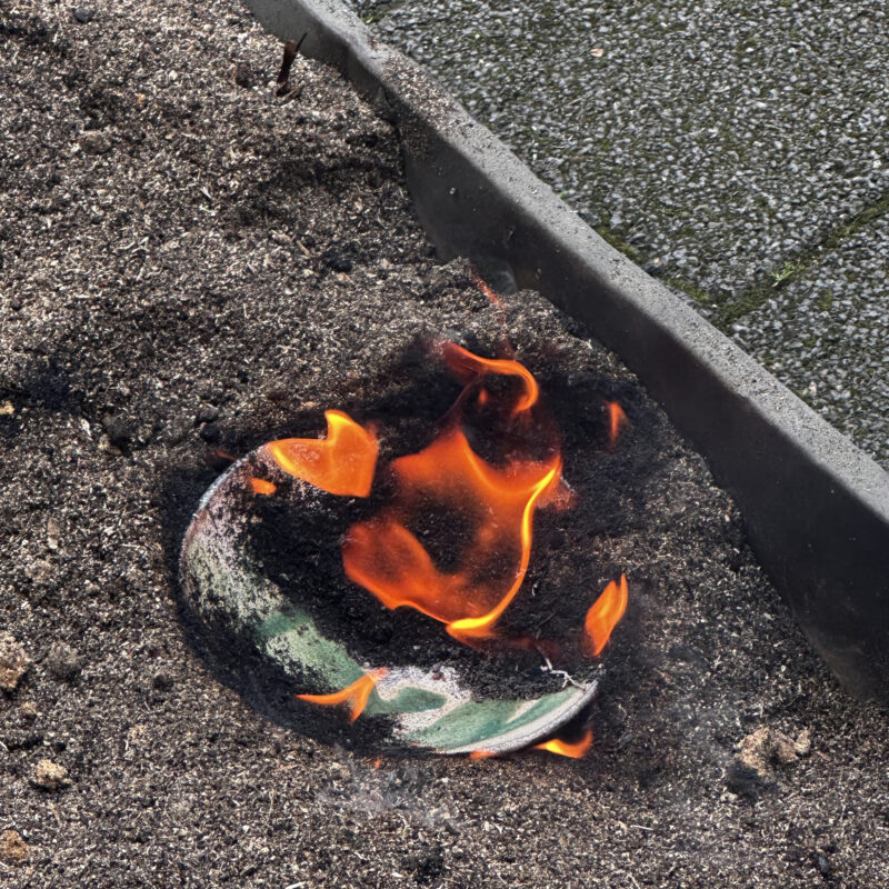 Raku ceramic piece on fire and smoking during a raku firing for a Zurich Design Week workshop